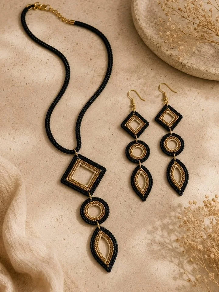 Elegant black and gold crochet jewelry set handcrafted for unique style.